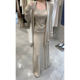 In The Autumn Of 2025, The New Women's Long-Sleeved Knitted Cardigan Is Hoisted With A High-Rise Half-Body Skirt.